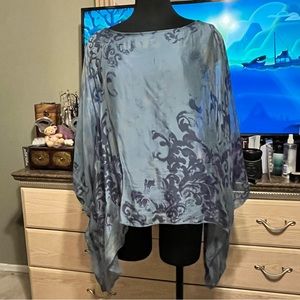 Hues of blue paisley chiffon top.  Lined with blue knit.